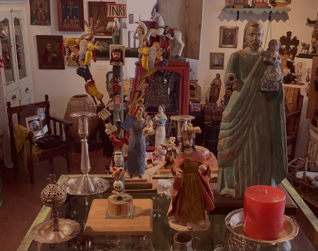 Photo of religious statues, candles and other antiques object from our Gallery